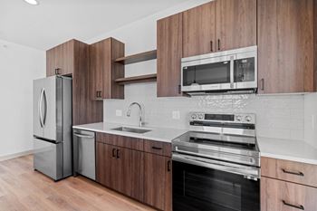 Kitchen with stainless steel appliances and wooden cabinets